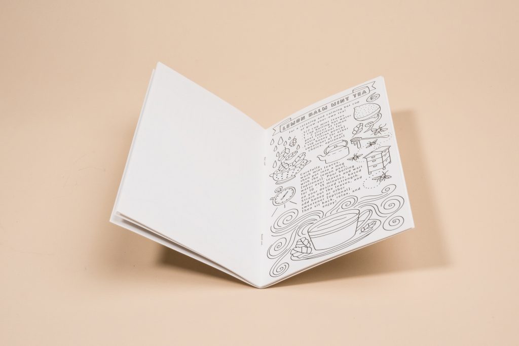 Close-up of cover and spine staples on a saddle stitch book -durable booklet format for custom coloring books or a personalized coloring book.
