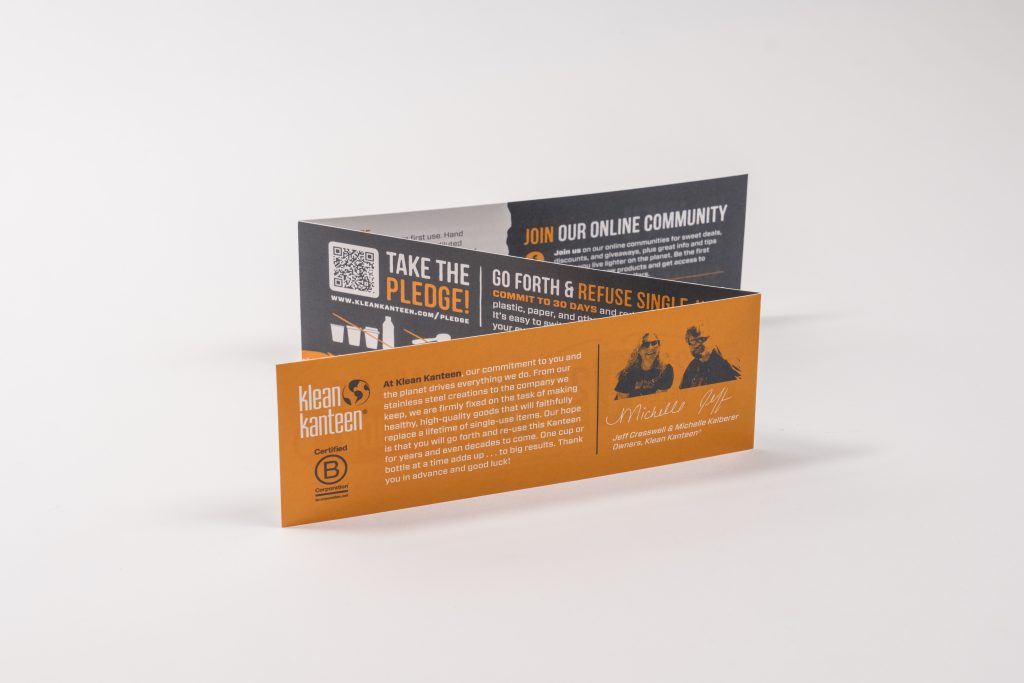 Z-fold brochure printing sample for Klean Kanteen, long horizontal panels with QR code and community callouts.