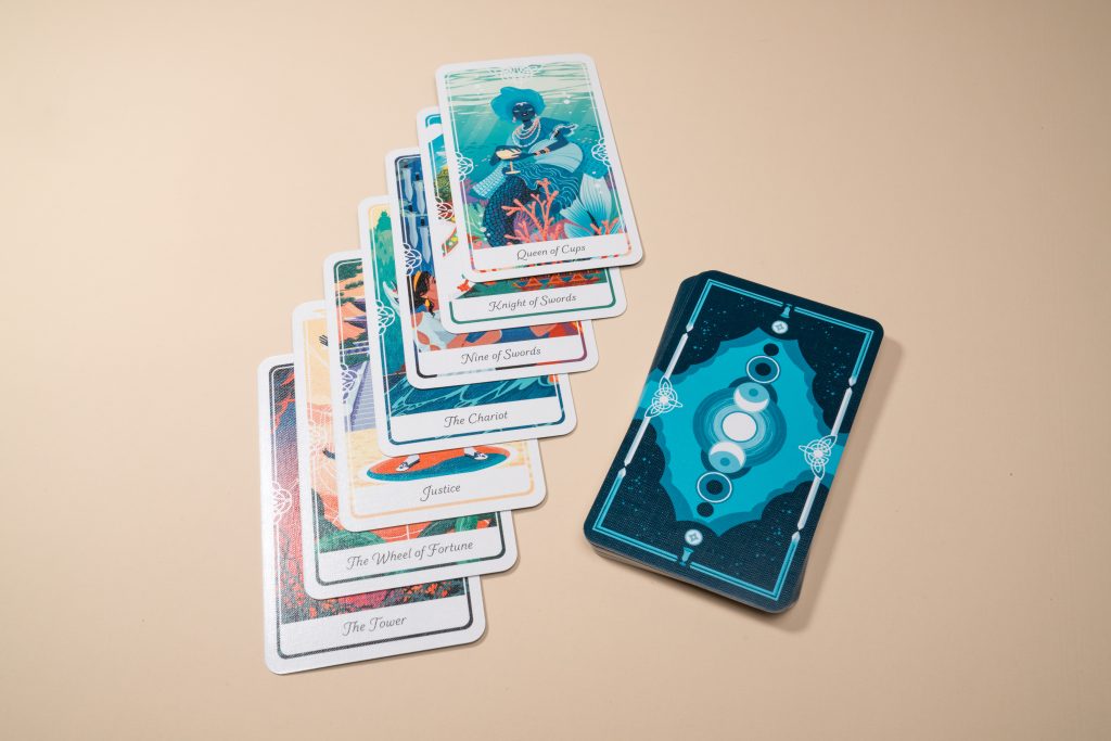 Illustrated custom card deck spread showing premium finish and rounded corners, sustainably printed by Greener Printer.
