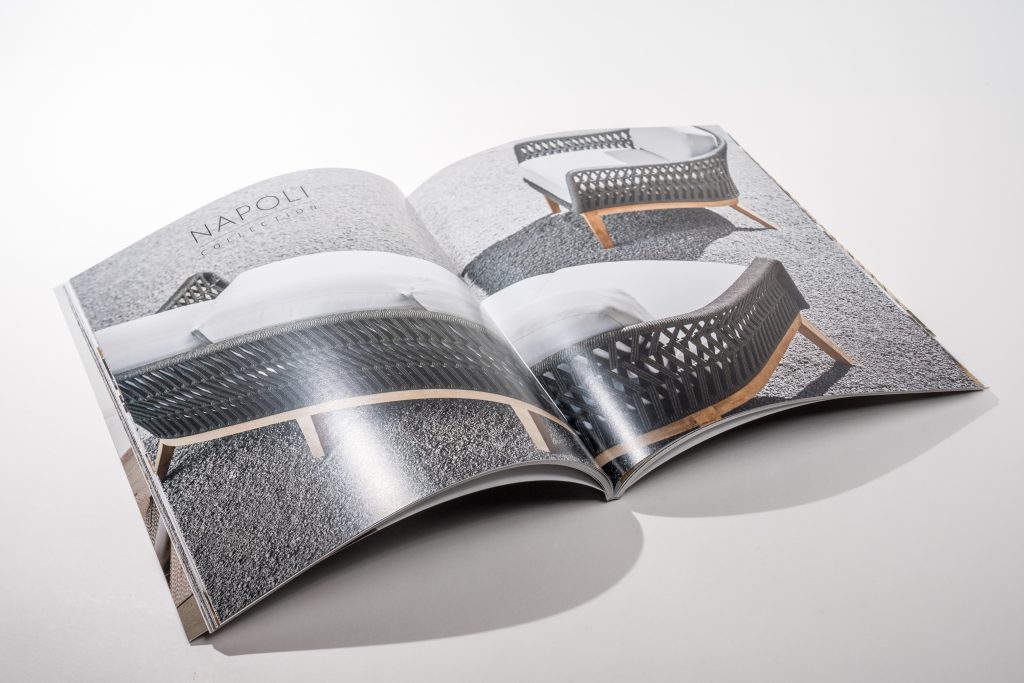 Glossy printed catalog with full-bleed photography and saddle-stitch binding.
