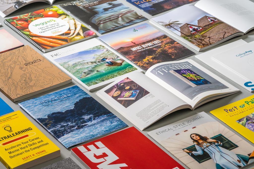 Close-up of perfect bound booklets with matte cover and glossy cover options.