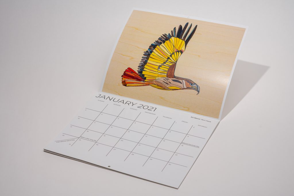 Image shows a custom saddle stich wall calendar.