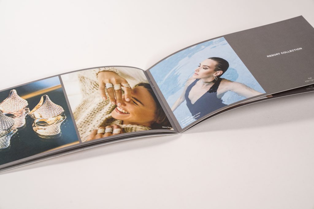 Long saddle-stitched booklet.