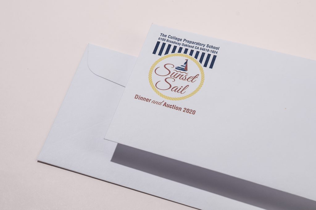 sunset snail artwork and logo envelope in close up