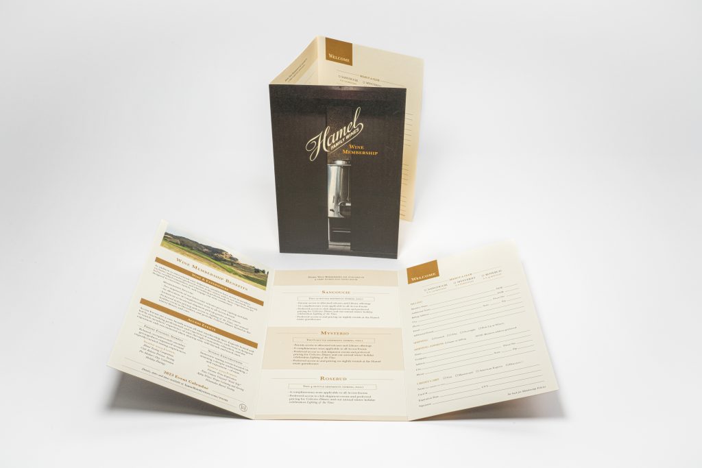 one standing brochure and one laid flat in the table