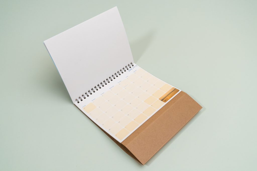 Custom branded desk calendar displayed on an office desk