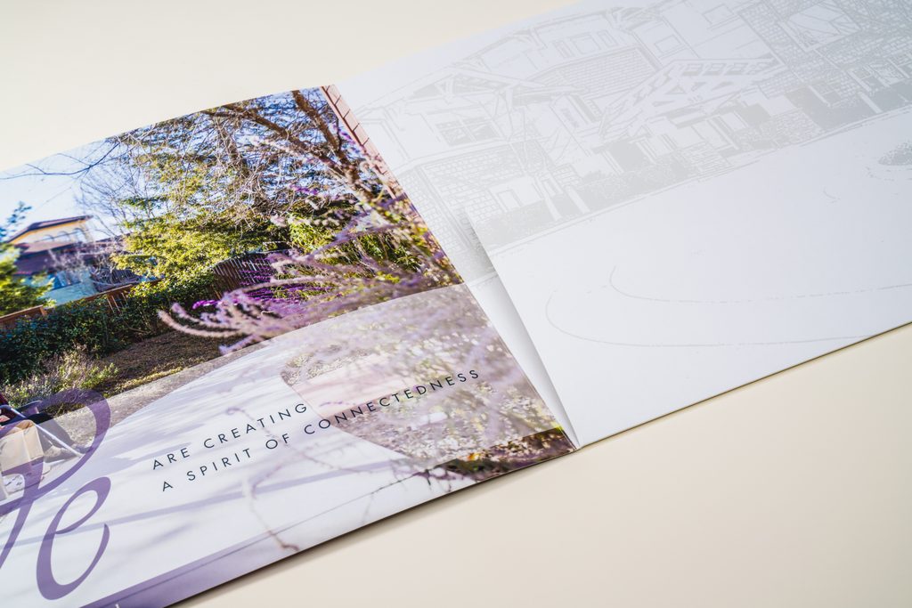saddle stitch booklet spread out on the table