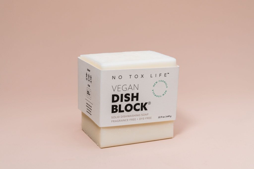Image shows a belly band packaging sleeve for soap, which allows customers to smell the product before buying it.